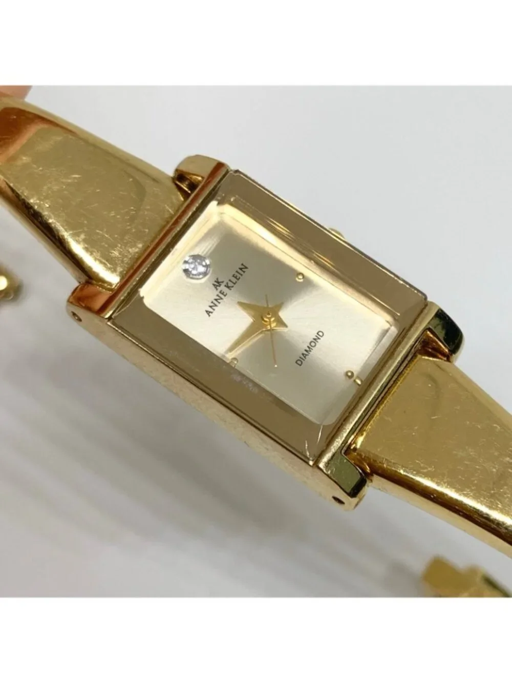 Anne Klein Diamond gold tone women watch 16mm rectangular quartz 6.5” running